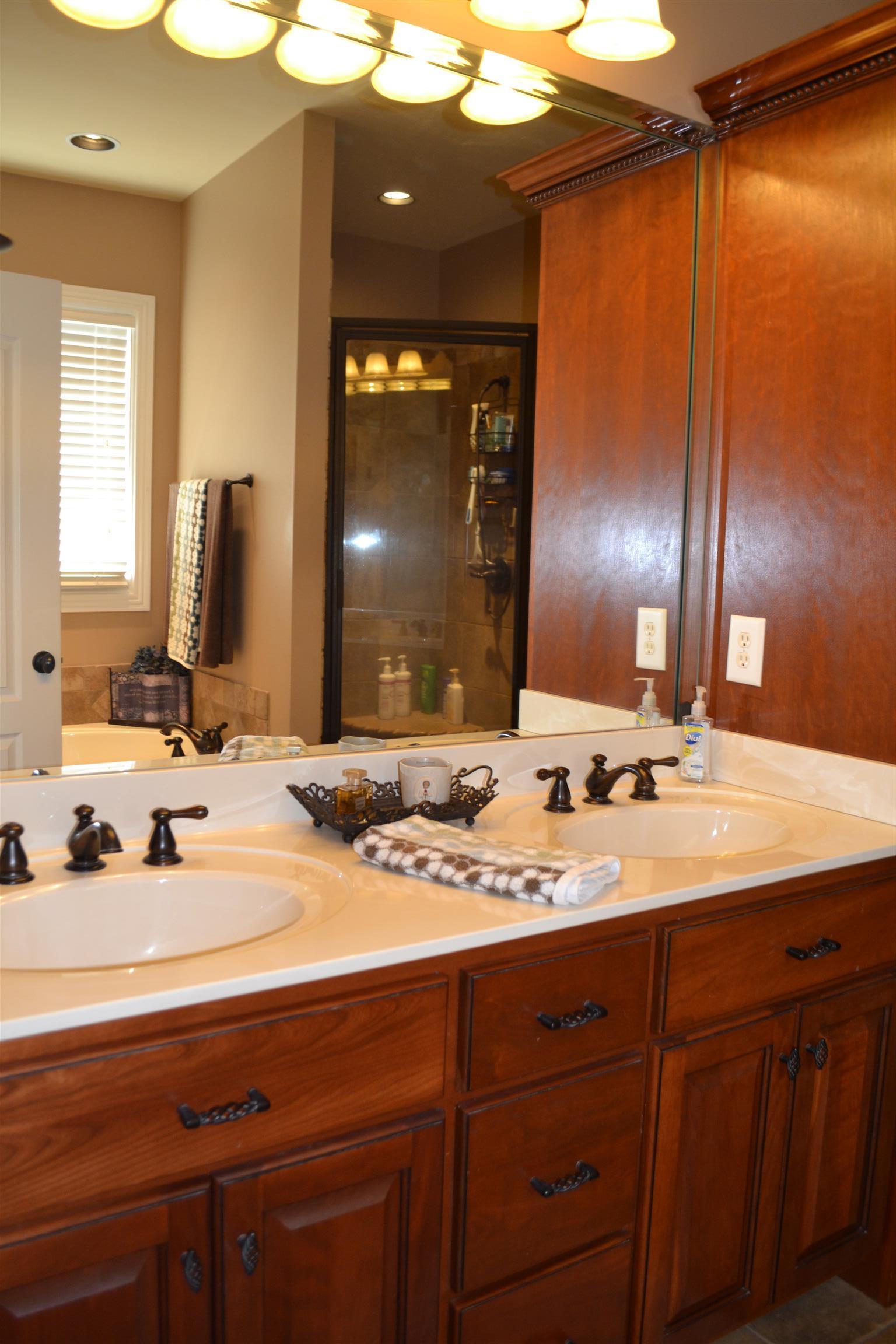 730 Walnut Grove Road Lebanon, TN 37090 - Photo 23 of 29 MASTER HAS CUSTOM DOUBLE VANITIES WITH MARBLE TOPS; SEPARATE TILE SHOWER AND JACUZZI TUBS;