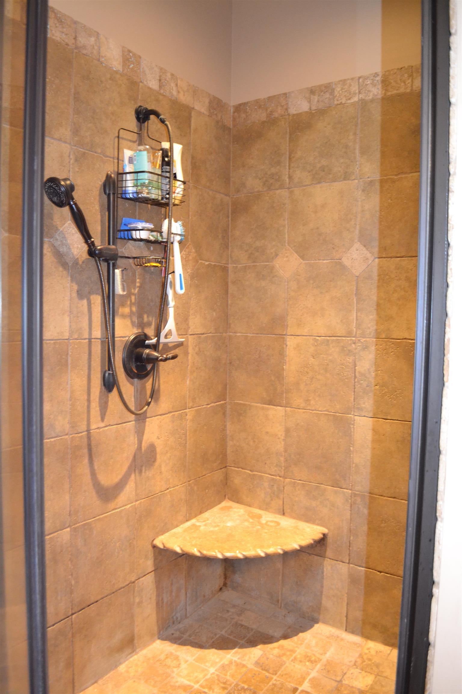 730 Walnut Grove Road Lebanon, TN 37090 - Photo 25 of 29 MASTER TILE SHOWER HAS 2 SHOWER HEADS WITH TILE SEAT; SEPARATE JACUZZI TUB WITH TILE SURROUND AND CUSTOM DOUBLE VANITY