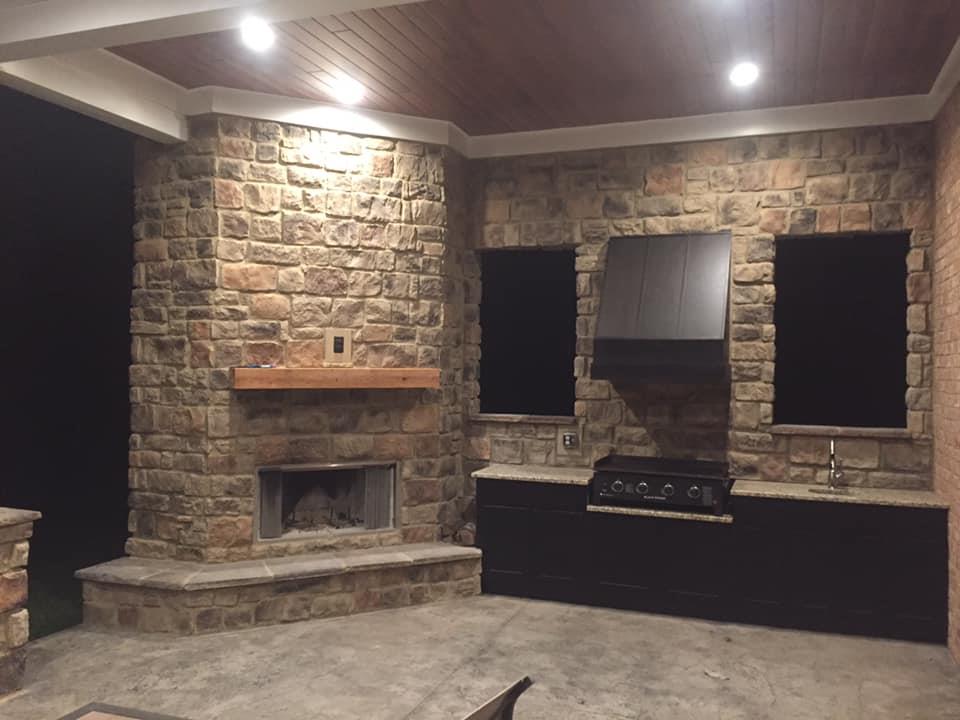 730 Walnut Grove Road Lebanon, TN 37090 - Photo 28 of 29 18X49 COVERED BACKPORCH HAS CUSTOM CABINETS WITH GRILL AND GAS FIREPLACE IN THE CUSTOM OUTSIDE LIVING COVERED WOOD CEILING BACK PORCH WITH SINK & GRANITE TOPS OVERLOOKING THE 11 ACRES; LOTS OF AREA FOR PLAY OR FOR GARDEN AREA