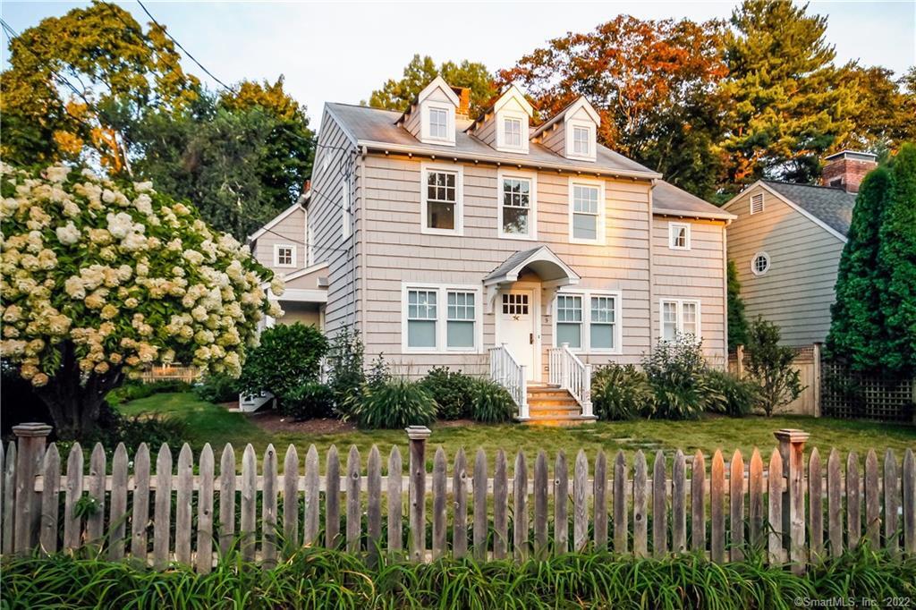 a view of a house with wooden fence