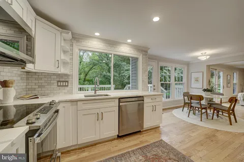 a kitchen with appliances cabinets and a sink