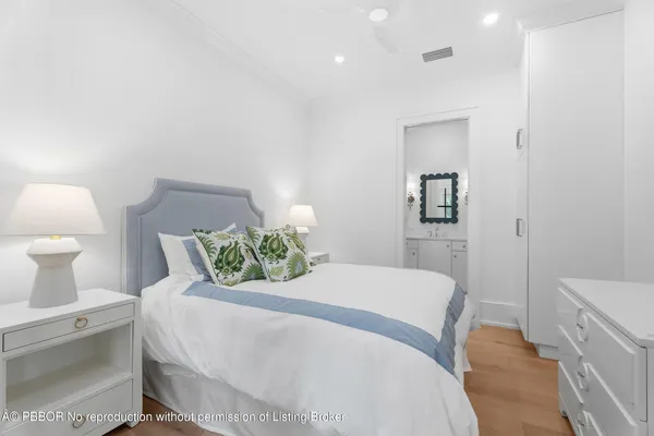 a bedroom with a bed and a lamp