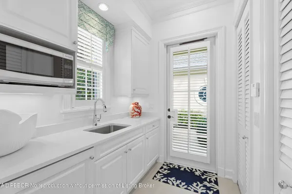 a kitchen with a sink and a window