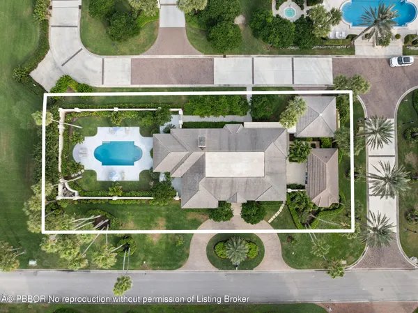 an aerial view of a house with garden space and street view