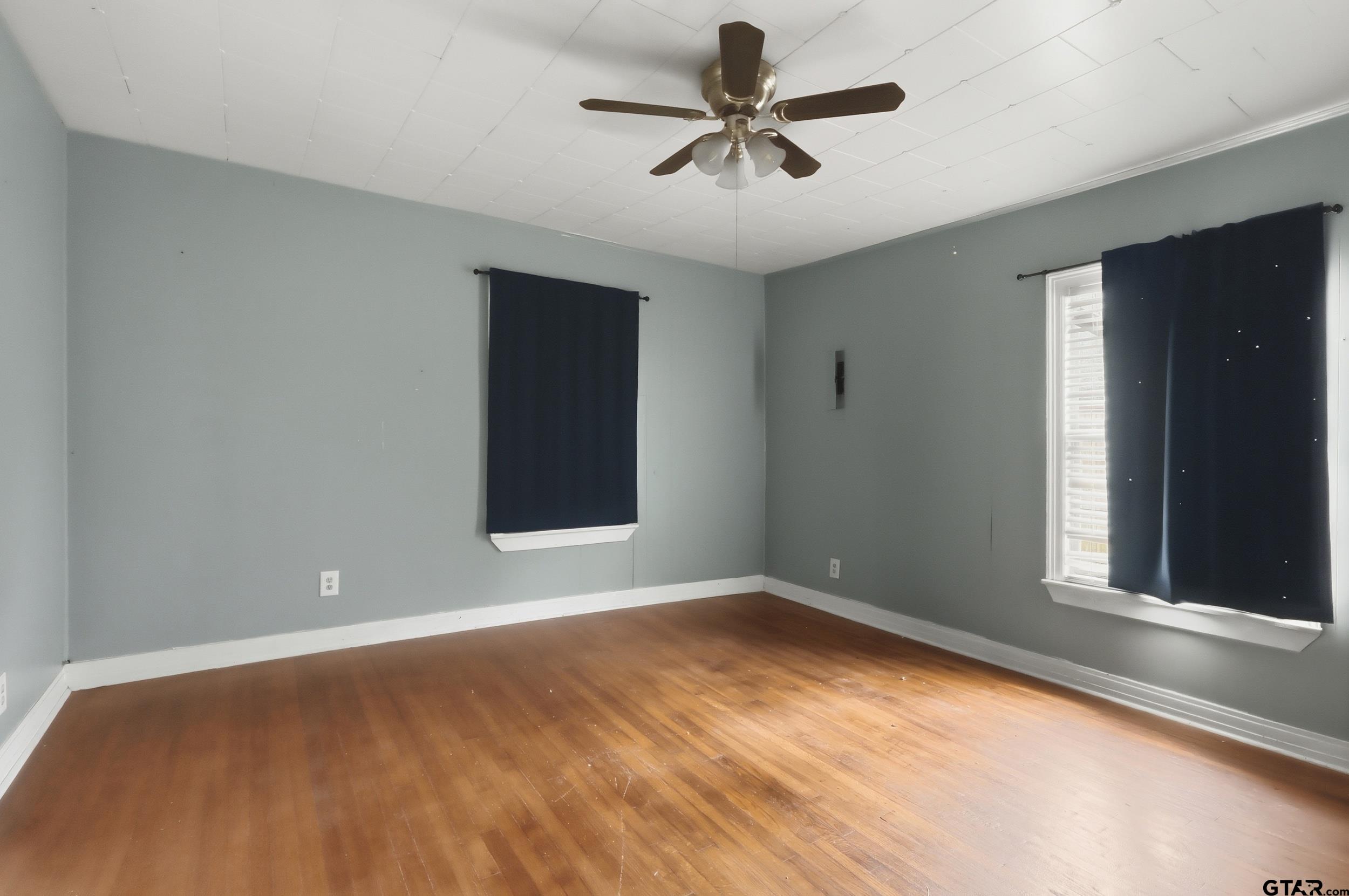405 Rusk Street Pittsburg, TX 75686 - Photo 14 of 33 a view of room with window and ceiling fan