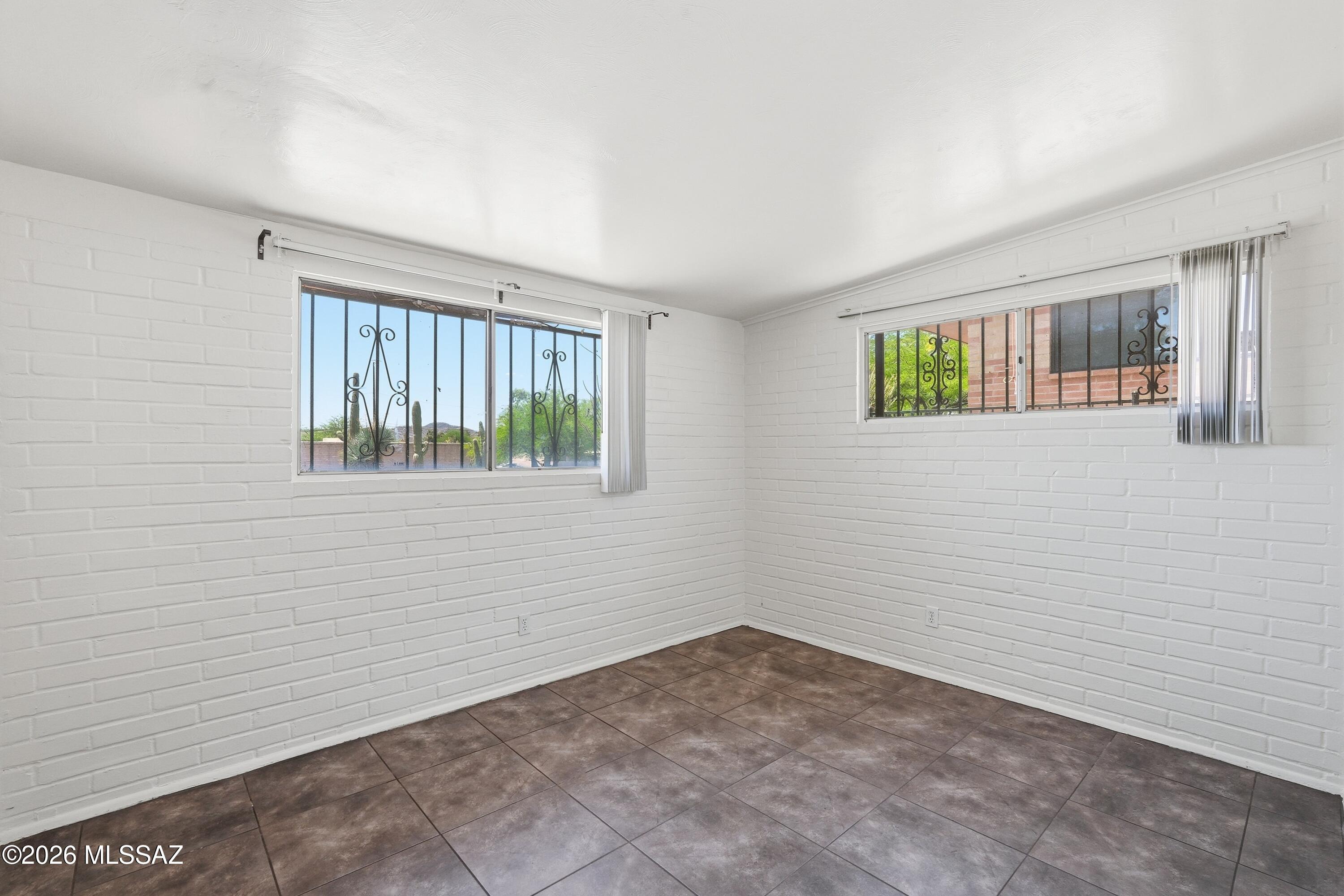 1808 West Caravelle Road Tucson, AZ 85713 - Photo 18 of 38 a view of an empty room with a window