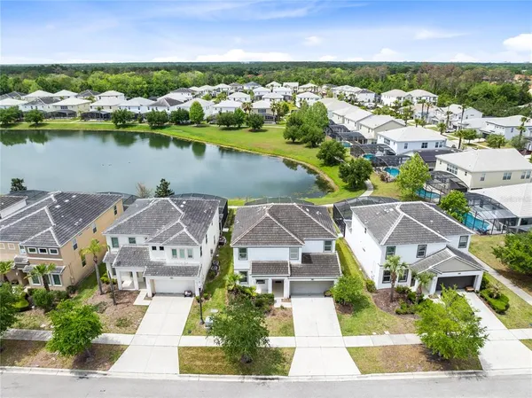 an aerial view of a house with a lake view