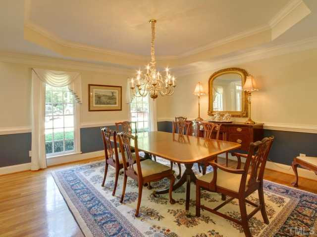 313 Carpathian Way Raleigh, NC 27615 - Photo 3 of 25 This large formal dining room can handle your large furniture. Details include trey ceiling, crown moulding chair rail and gleaming hardwood floors. Dining Room