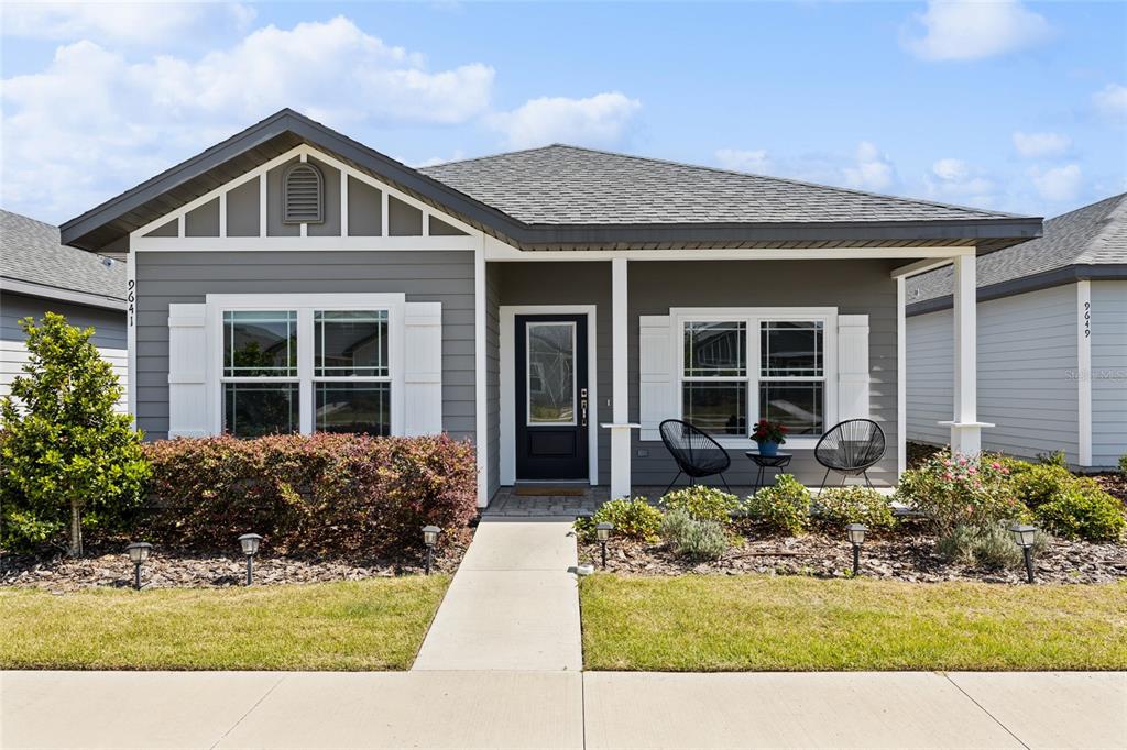9641 Southwest 67th Drive Gainesville, FL 32608 - Photo 1 of 1 a front view of a house with garden