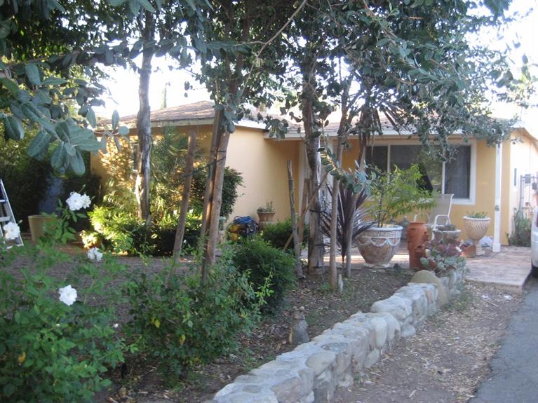 72 Chaparral Road Oak View, CA 93022 - Photo 1 of 3 a view of a house with a tree and garden