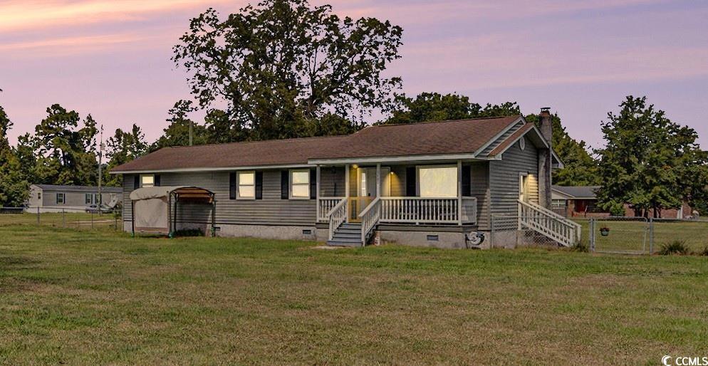 Ranch-style home featuring crawl space, a porch, and a chimney