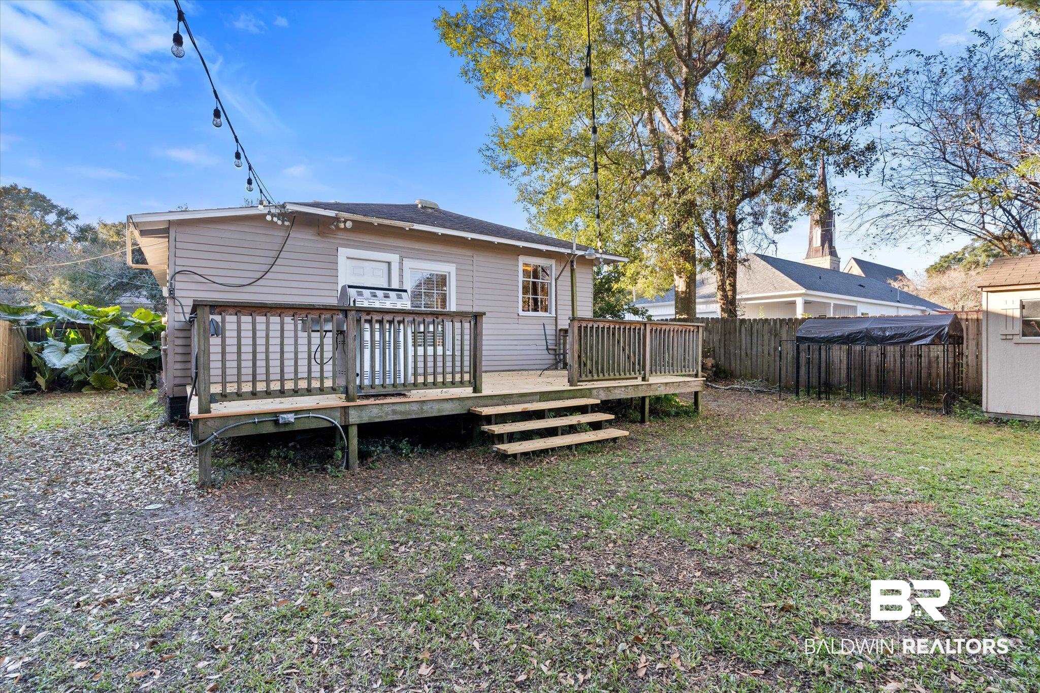 7 Rickarby Place Mobile, AL 36606 - Photo 19 of 20 Back of house with a lawn and a deck