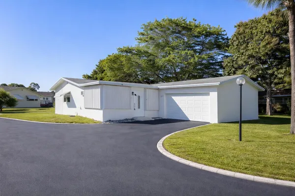 a view of a house with backyard