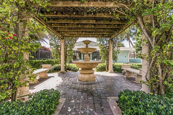 a front view of a house with outdoor seating