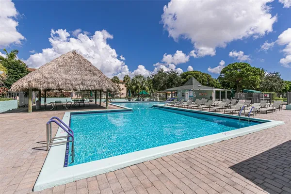 a view of a swimming pool with a patio