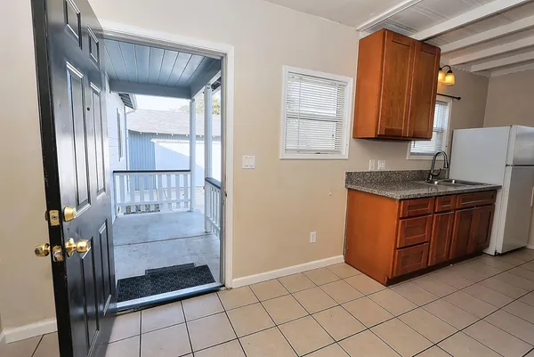 a view of storage and utility room with closet dryer