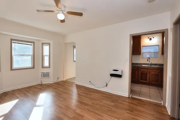 a kitchen that has a sink and a stove