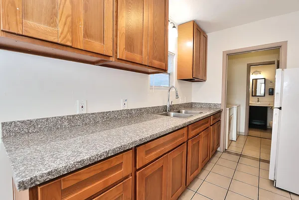 a kitchen with stainless steel appliances granite countertop a stove and a sink