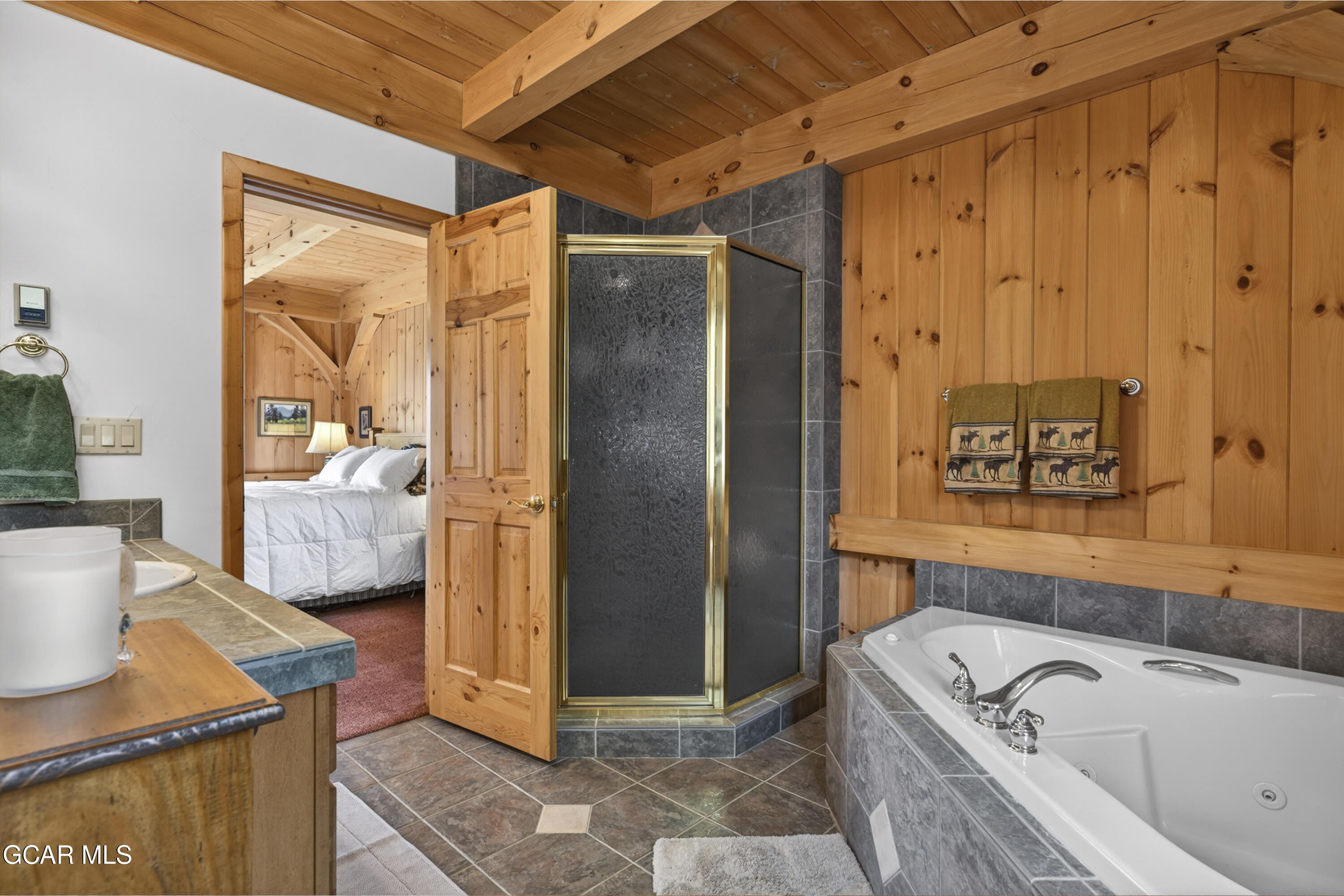 400 Ridge Road Tabernash, CO 80478 - Photo 19 of 50 a bathroom with a bathtub and a shower