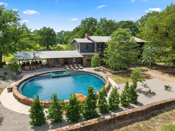a view of a swimming pool with a patio