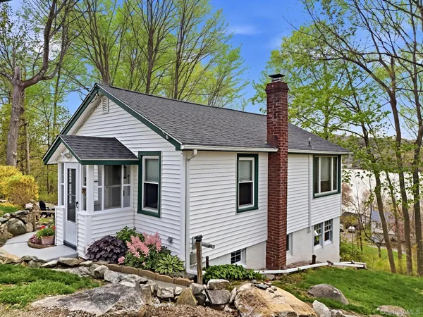 a front view of a house with a porch