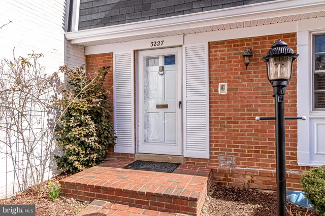 a view of a brick house with a large windows