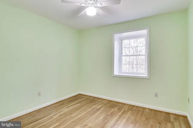 wooden floor in an empty room with a fireplace