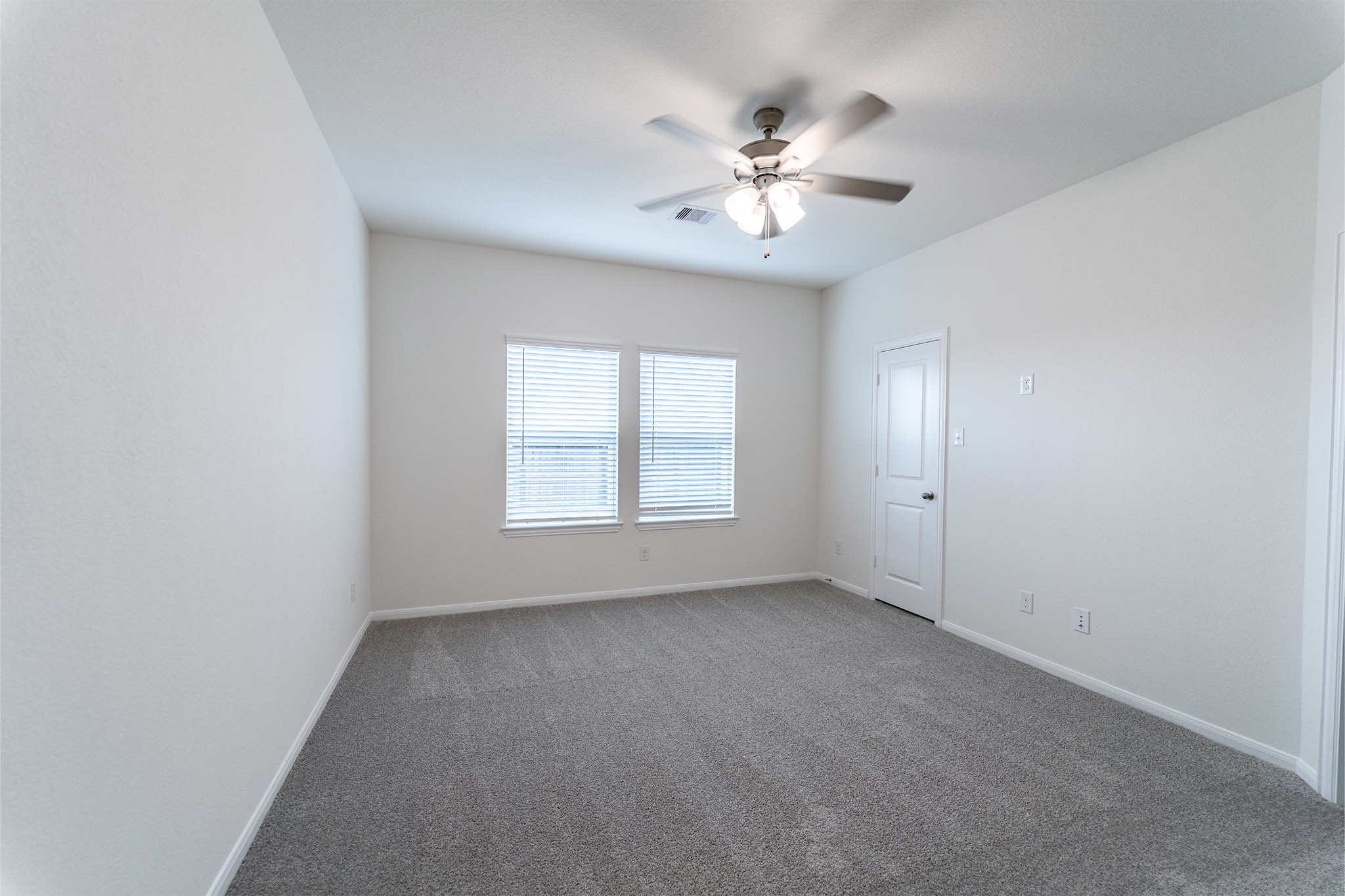 3527 Prairie Rose Trail Angleton, TX 77515 - Photo 12 of 19 a view of an empty room with a chandelier fan