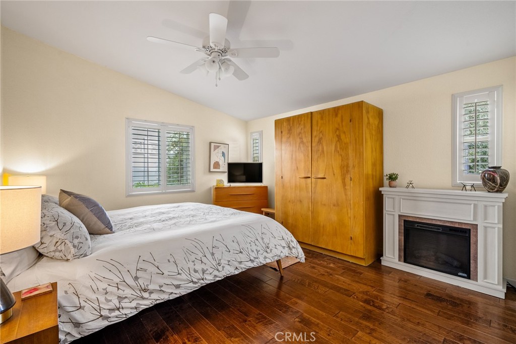 378 Lark Drive Paso Robles, CA 93446 - Photo 15 of 33 a bedroom with a bed and a fireplace