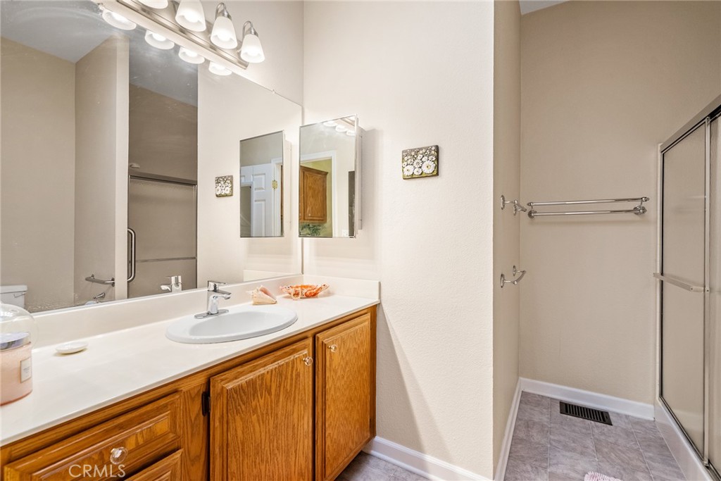 378 Lark Drive Paso Robles, CA 93446 - Photo 16 of 33 a bathroom with a sink a vanity and a mirror