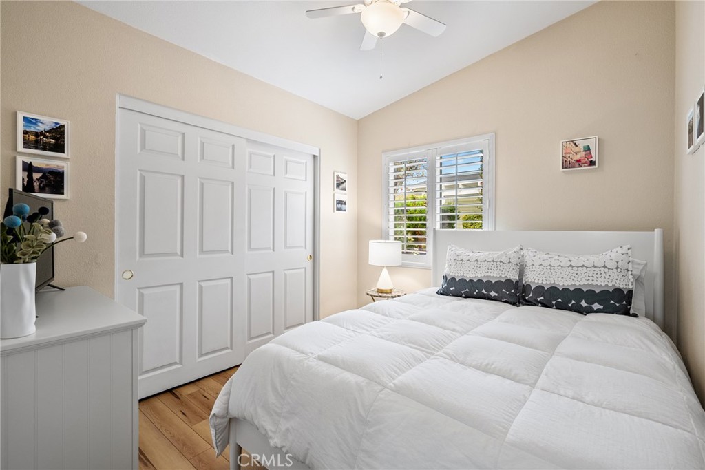 378 Lark Drive Paso Robles, CA 93446 - Photo 18 of 33 a bedroom with a bed and a chandelier