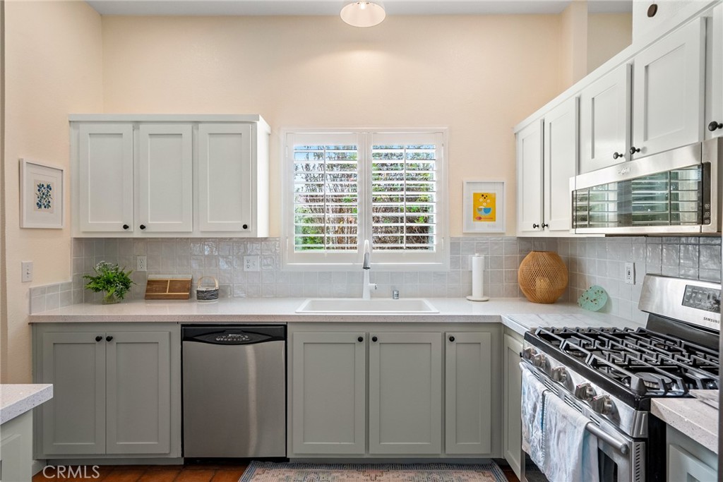 378 Lark Drive Paso Robles, CA 93446 - Photo 5 of 33 a kitchen with granite countertop a sink a stove and cabinets