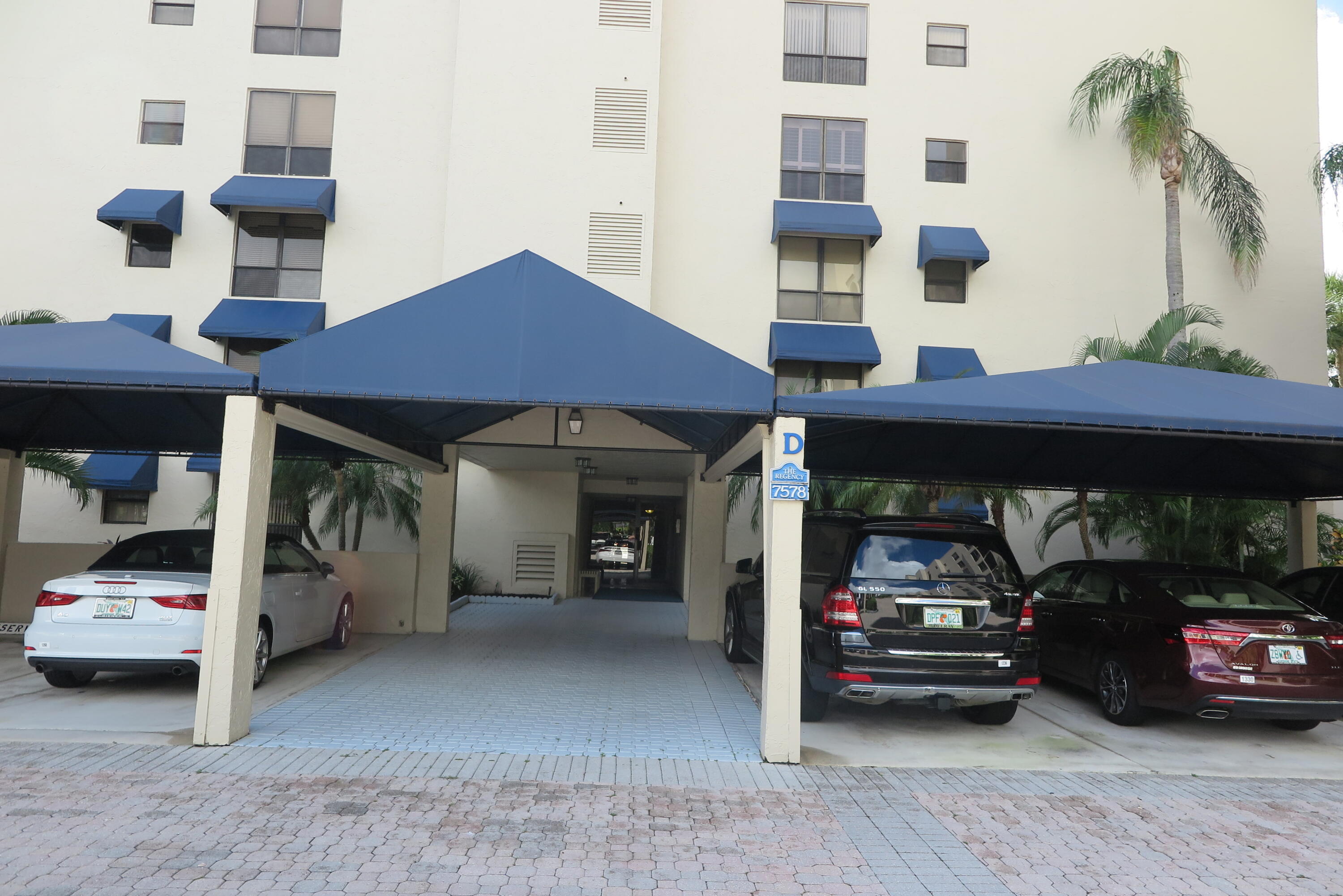 7578 Regency Lake Drive, Unit 501 Boca Raton, FL 33433 - Photo 1 of 32 a view of building with car parked