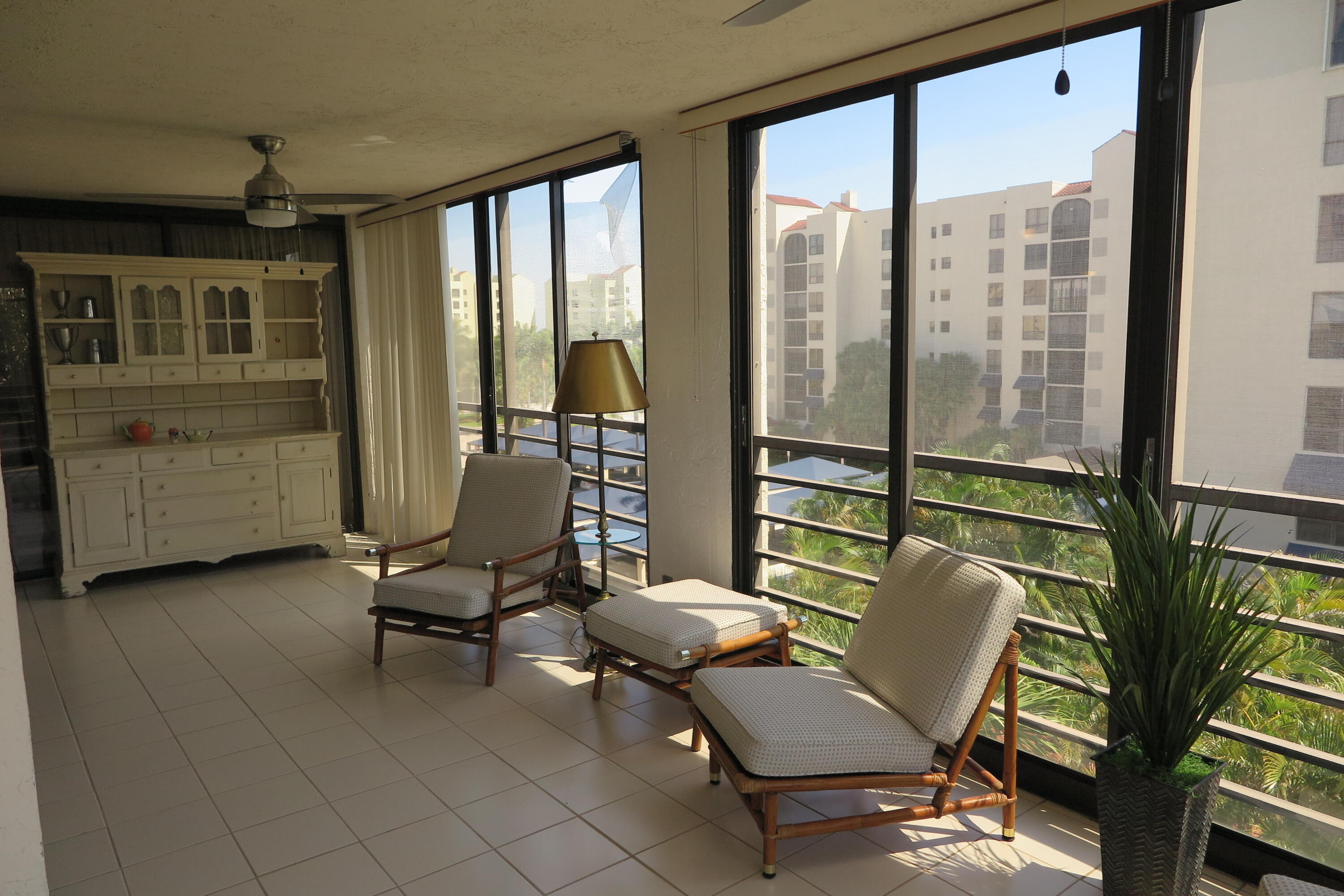 7578 Regency Lake Drive, Unit 501 Boca Raton, FL 33433 - Photo 12 of 32 a living room with furniture and a window