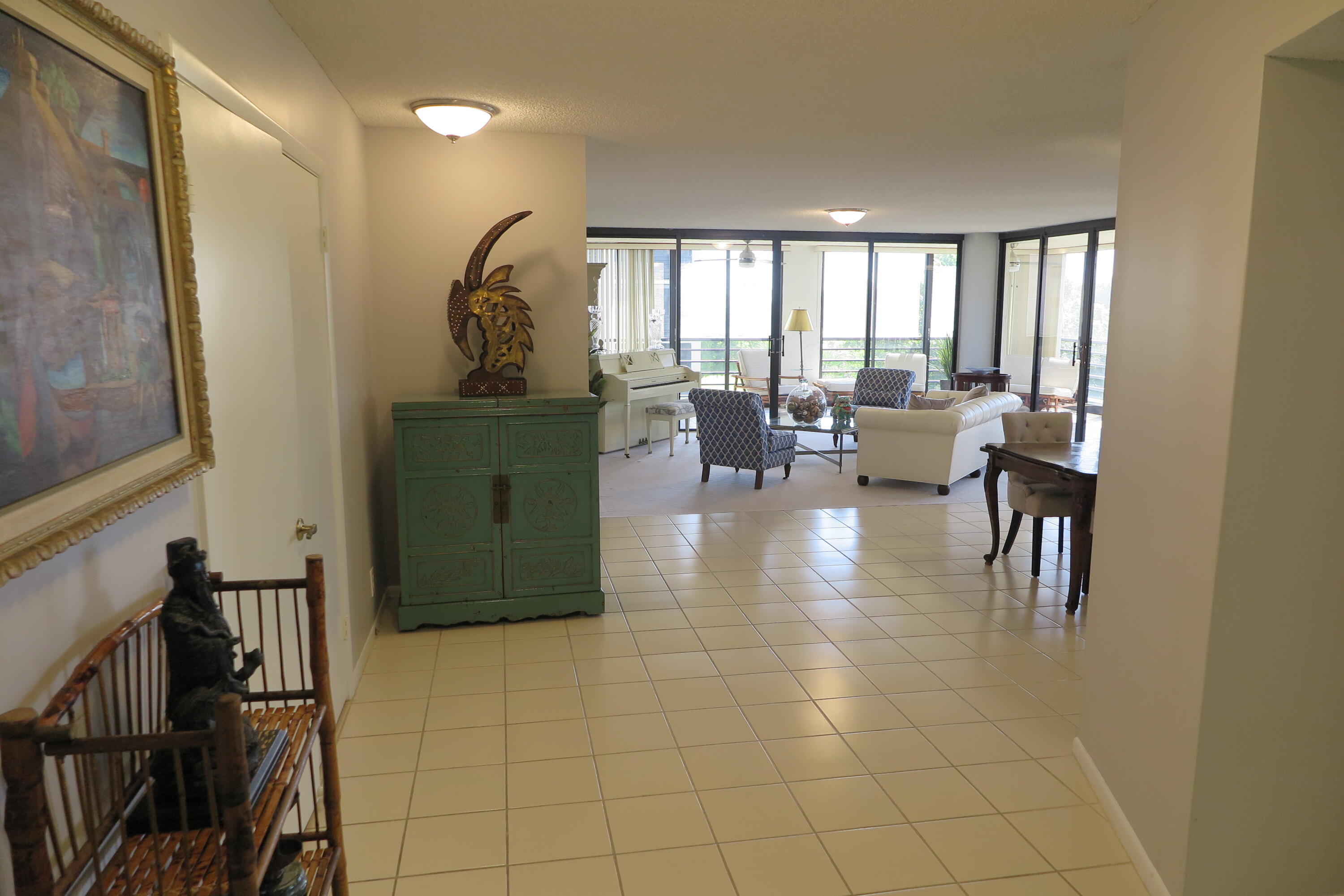 7578 Regency Lake Drive, Unit 501 Boca Raton, FL 33433 - Photo 2 of 32 a view of a dining room with furniture