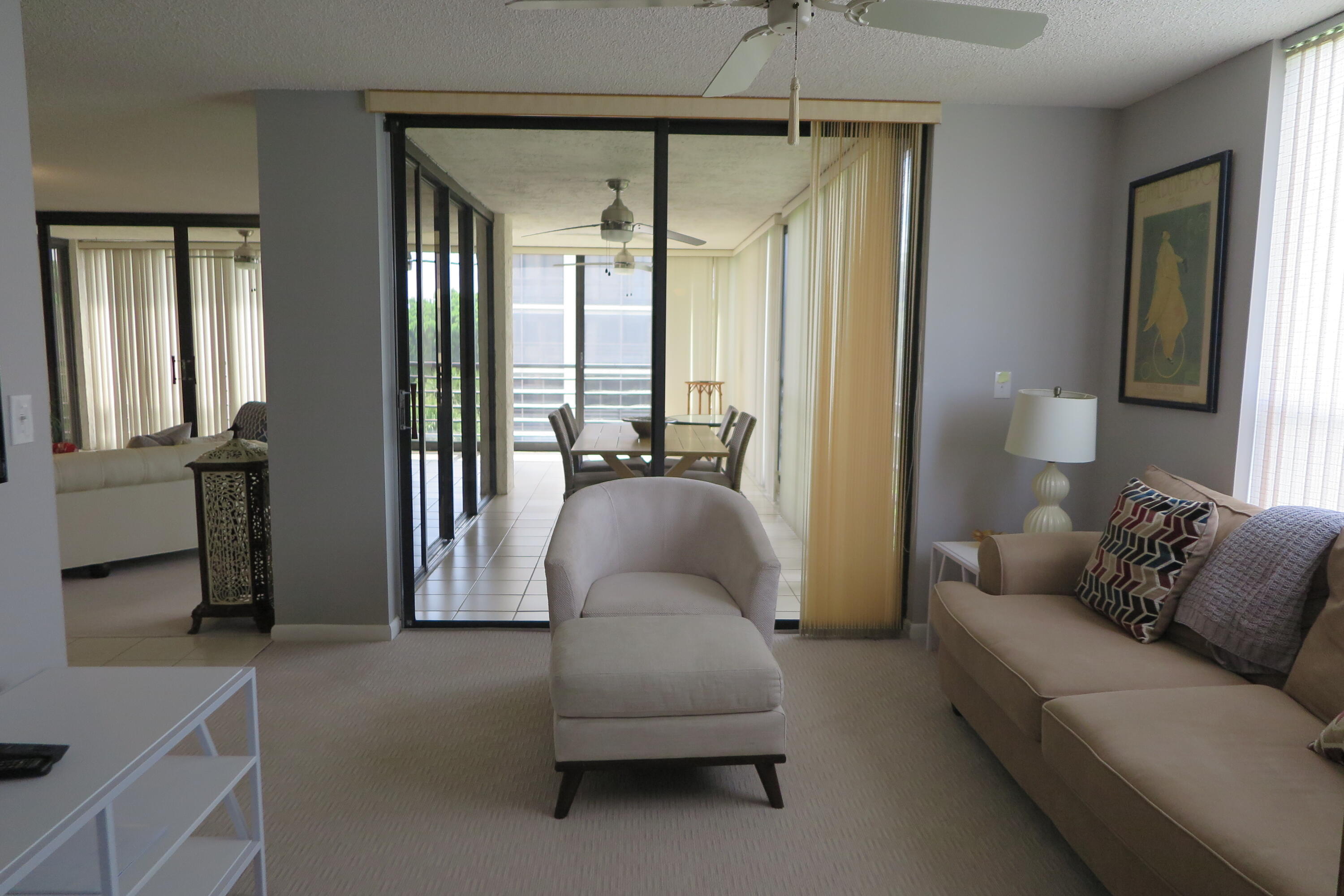 7578 Regency Lake Drive, Unit 501 Boca Raton, FL 33433 - Photo 23 of 32 a living room with furniture and a window