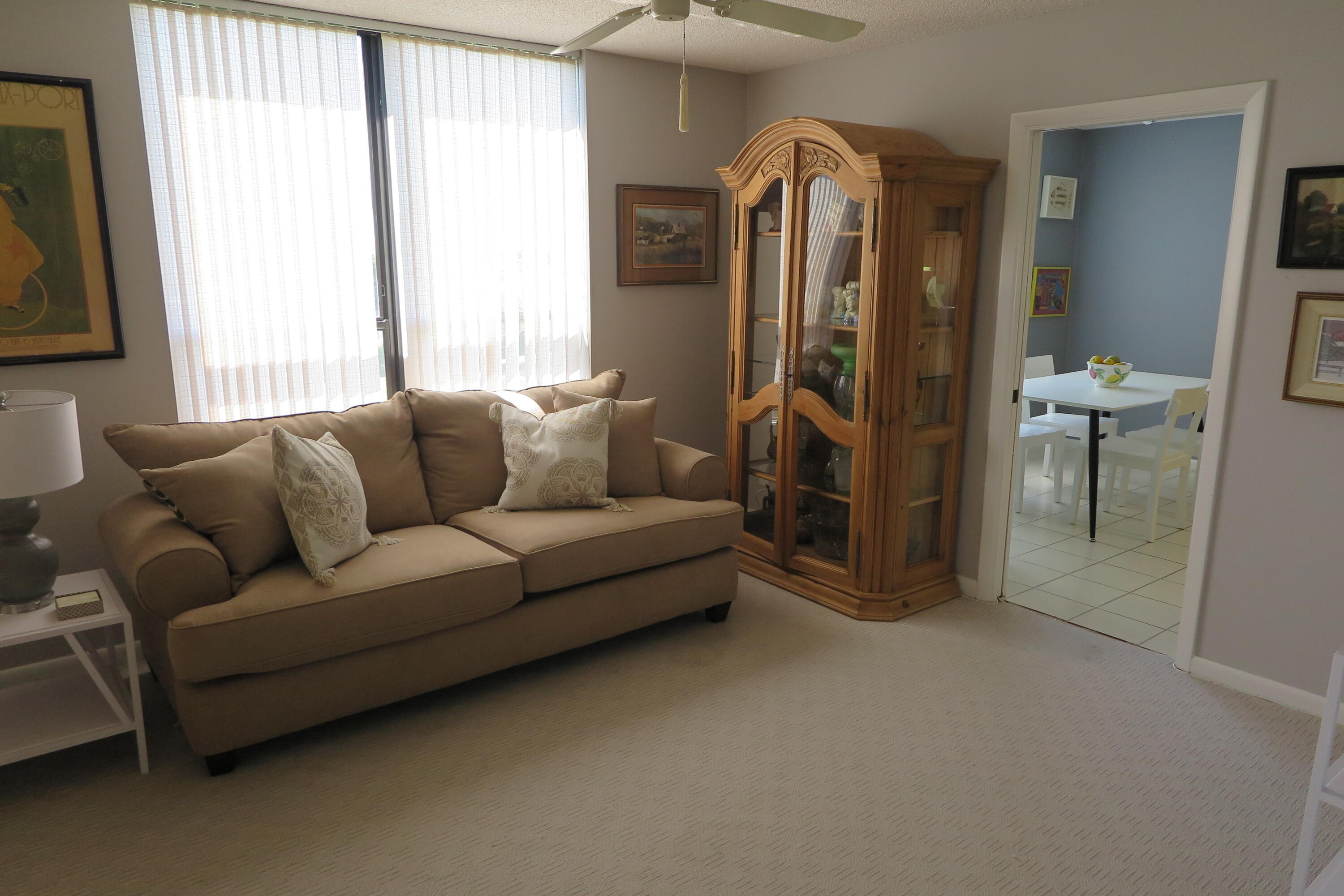 7578 Regency Lake Drive, Unit 501 Boca Raton, FL 33433 - Photo 24 of 32 a living room with furniture and a window