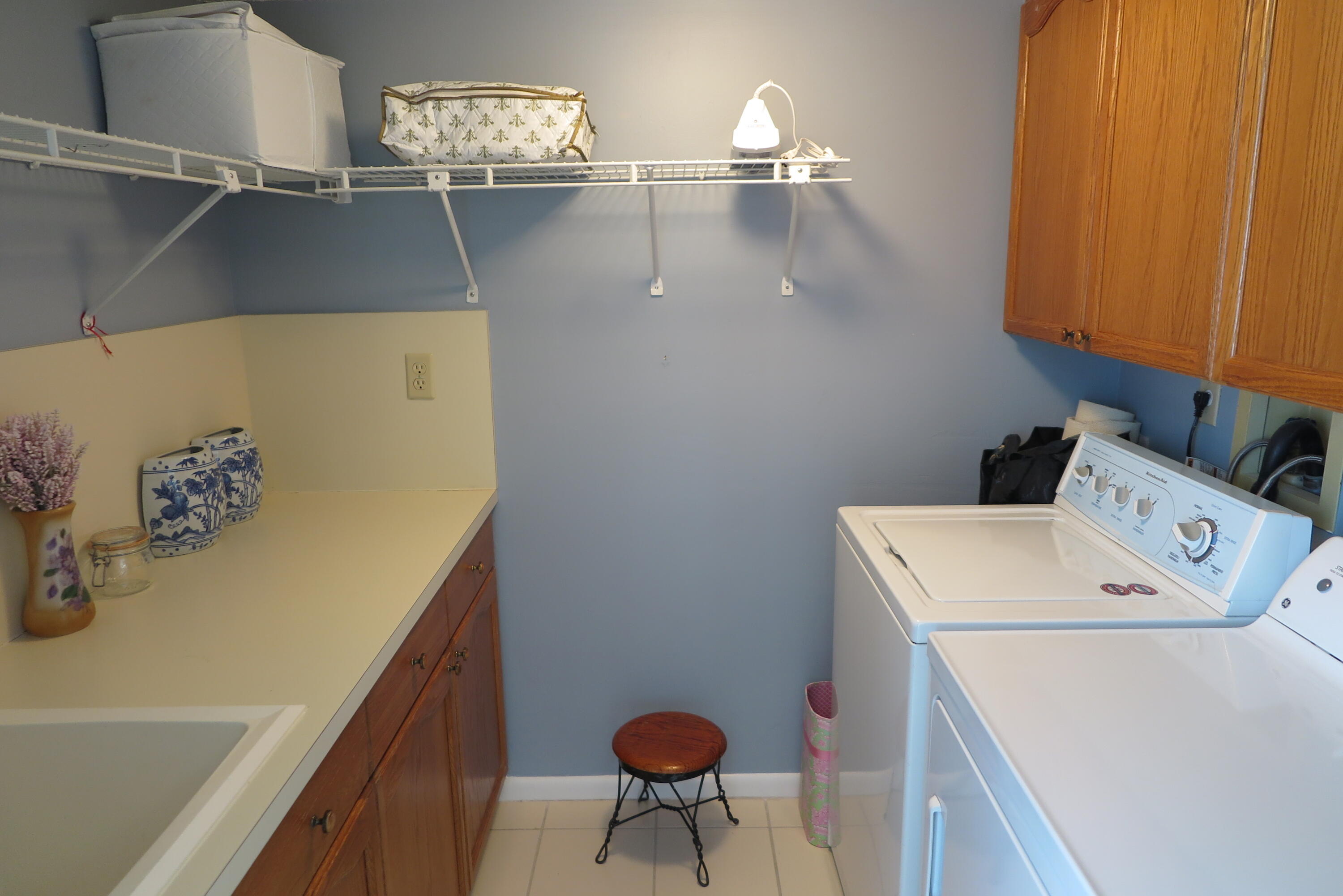 7578 Regency Lake Drive, Unit 501 Boca Raton, FL 33433 - Photo 27 of 32 a utility room with a washer and dryer