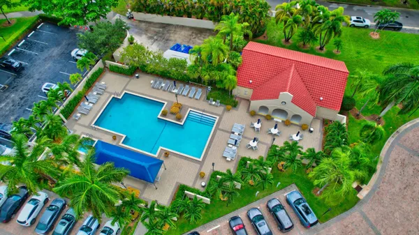 a view of a patio with swimming pool table and chairs