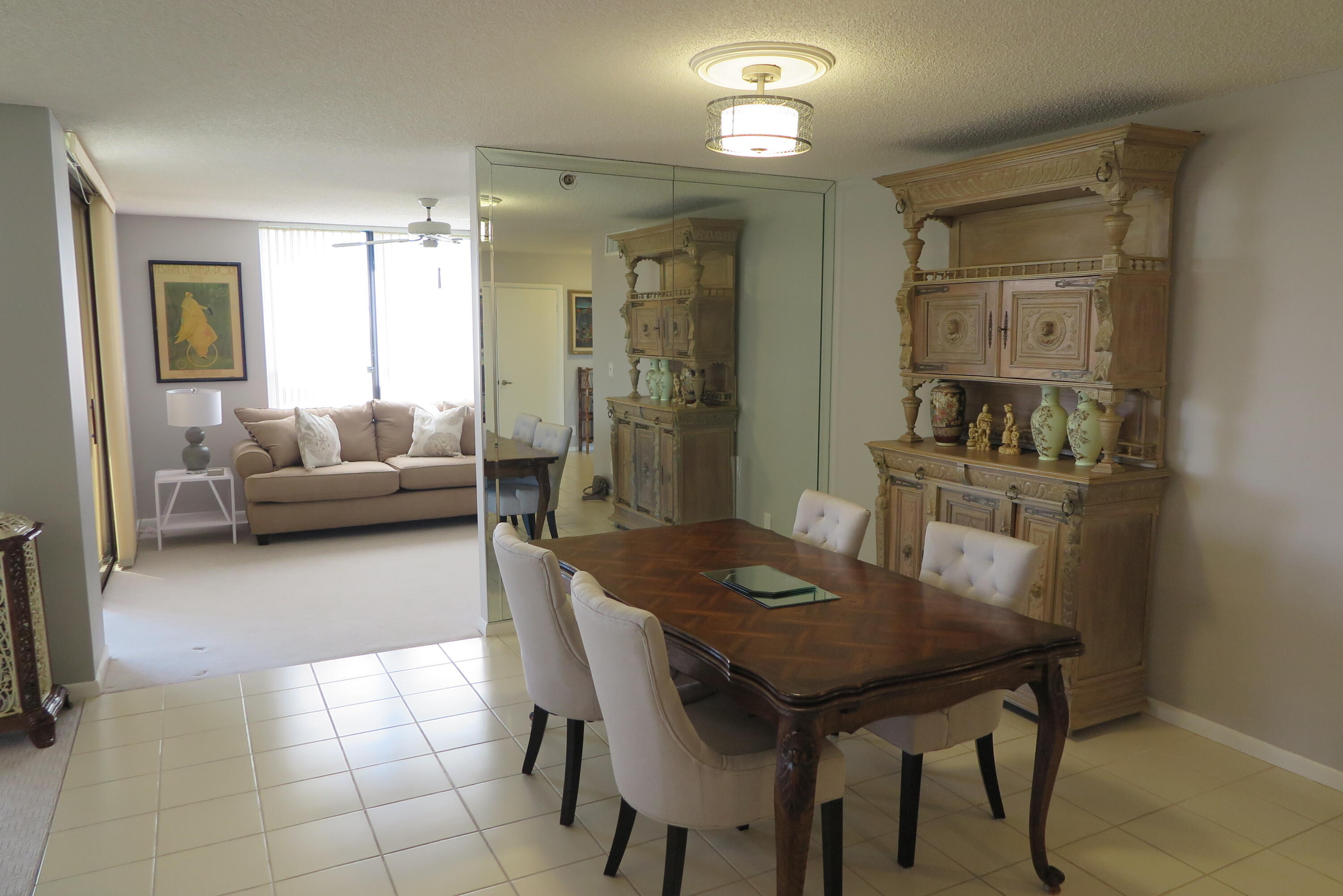 7578 Regency Lake Drive, Unit 501 Boca Raton, FL 33433 - Photo 6 of 32 a view of a dining room with furniture and window