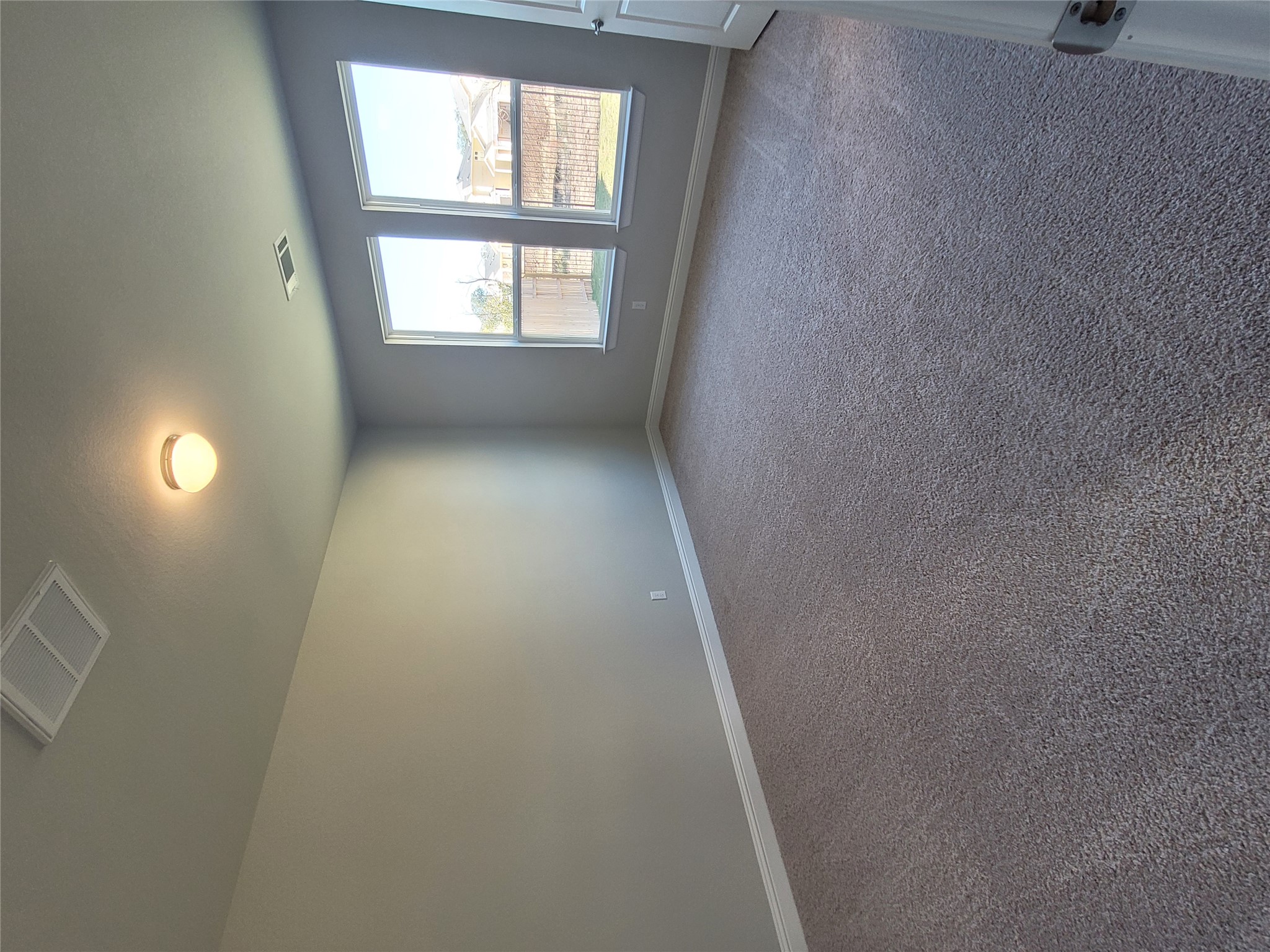 120 Free Stone Drive Georgetown, TX 78628 - Photo 11 of 40 A spacious room offers new carpet and multiple windows, providing abundant natural light.