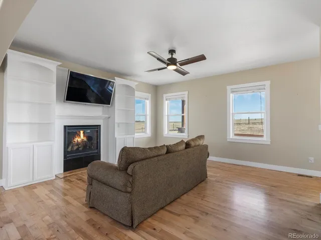 a bathroom with a toilet sink vanity and mirror