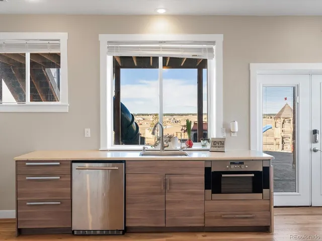 a view of house with yard and sitting area