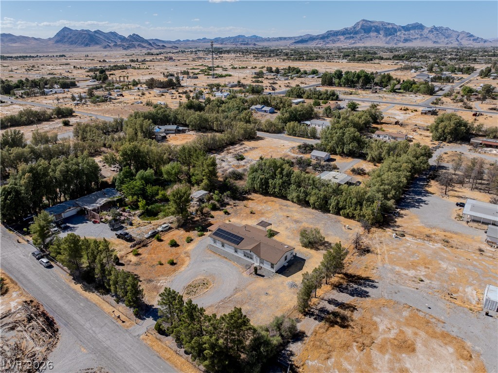 1890 West Dyer Road Pahrump, NV 89048 - Photo 27 of 40 Perched on expansive grounds, this property offers panoramic mountain views and a serene, secluded setting.