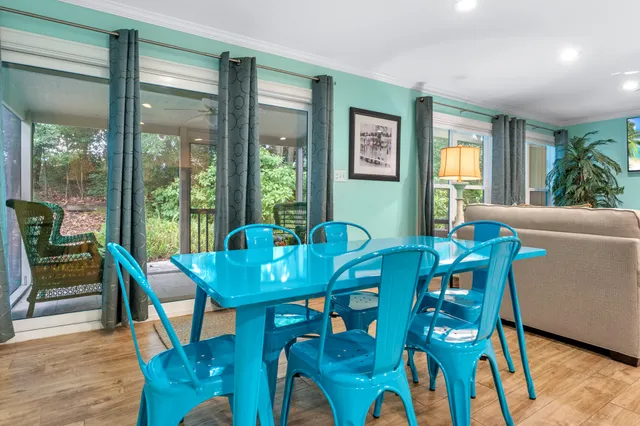 a view of a dining room with furniture window and wooden floor