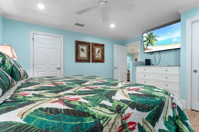 a bedroom with a bed and a mirror