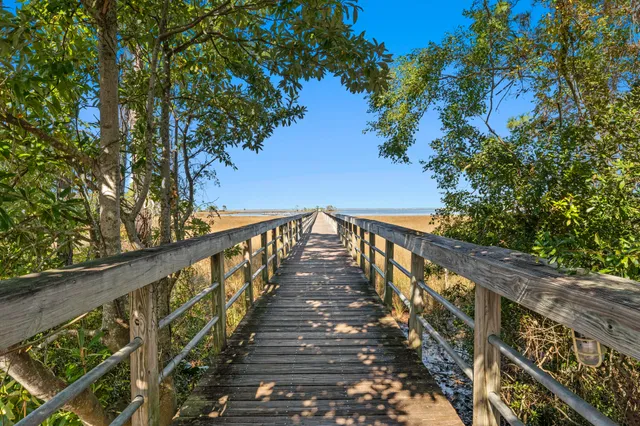 a view of a balcony with wooden stairs