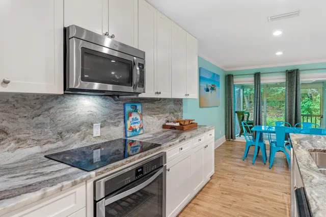 a kitchen with a stove and a microwave