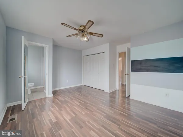 a view of an empty room and wooden floor