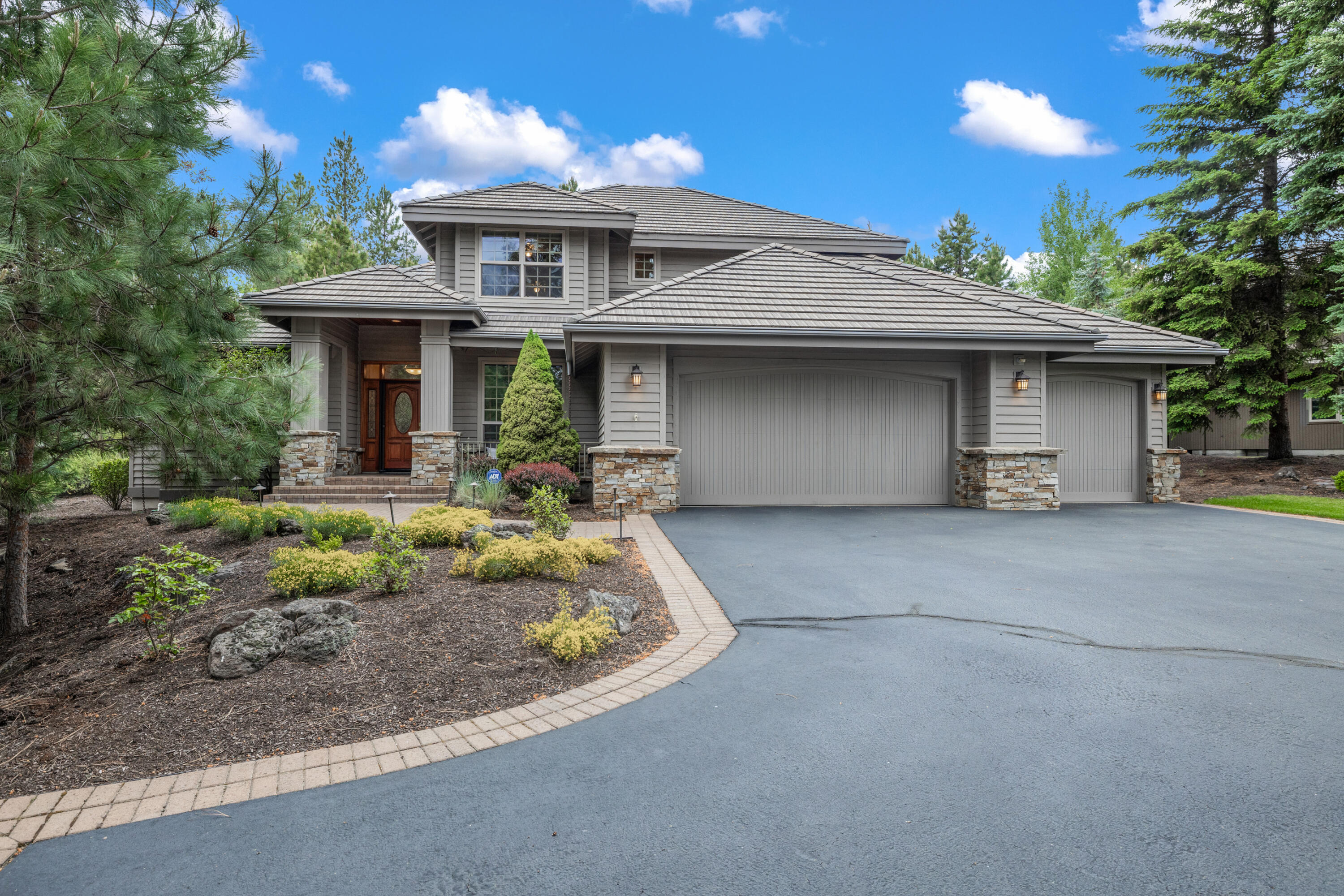 19598 Green Lakes Loop Bend, OR 97702 - Photo 1 of 89 a front view of a house with a yard